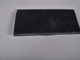 a black wallet sitting on a white surface