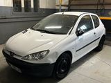 a small white car parked in a garage