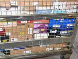 a metal cart with many boxes on top of it
