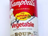 a can of vegetable soup on a white surface