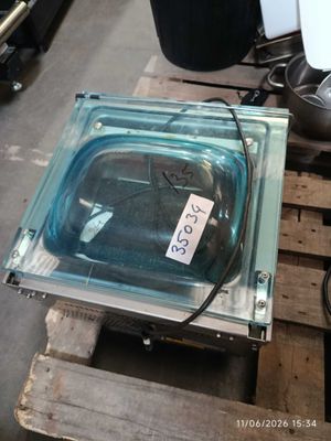 a glass container with a price tag on it on a pallet