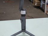 a camera that is sitting on a tripod on a table