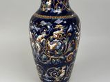 an image of a blue and gold vase on a white background