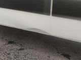 a white van parked on the side of the road