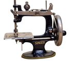 a black and silver sewing machine on a white background