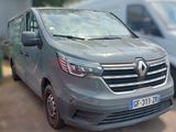 a grey van that is parked on the side of the road