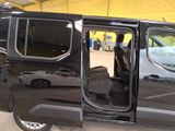 a black van that is parked in a parking lot