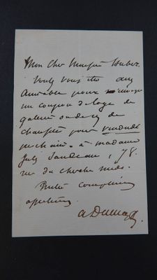 une vieille lettre écrite à la main sur un morceau de papier avec une écriture dessus
