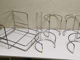 four chairs that are sitting on a white table