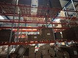 a large amount of boxes on the shelves in the warehouse