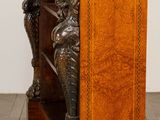 a wooden table with a statue on top of it