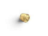 a close up of a gold ring on a white surface