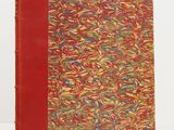 a book with a red cover and a pattern on it