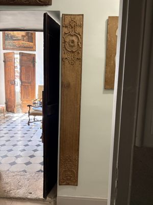 a doorway leading to a room with a chair and a table