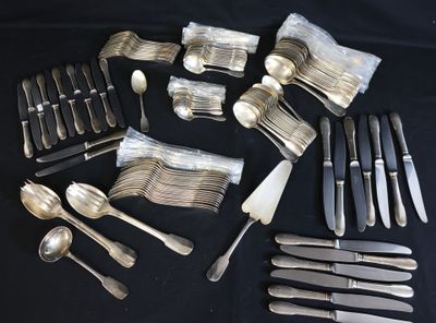 a lot of silverware on a table with a black background