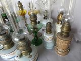 a lot of glass lamps that are on a table