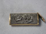 an image of a small metal box with a horse on it