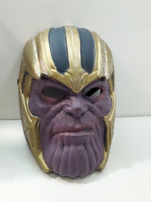 thanos mask sitting on a white surface with a white background