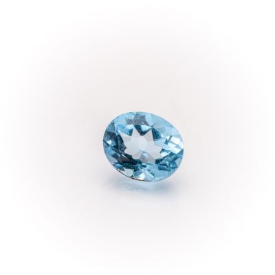 an oval blue topaze gems on a white background