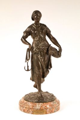 bronze statue of a woman holding a dog on a marble base