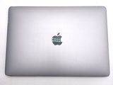 a silver laptop with an apple logo on the screen
