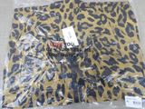 a leopard print shirt wrapped in plastic on the floor
