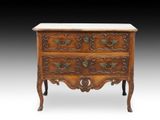 an antique chest of drawers with marble top