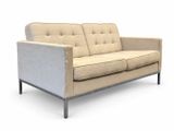 the couch is beige and has a metal frame on the legs