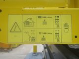 a yellow sign on the back of a yellow truck