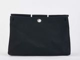 a black bag with a white handle on a white background