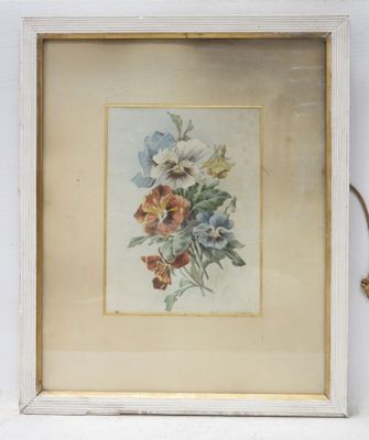 an image of a picture of flowers in a frame on a shelf