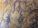 drawing of a group of people on a wall in a room