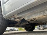 a close up of a car ' s tire on the street