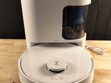 an image of a white coffee maker sitting on top of a wooden table