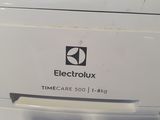 a close up of a washing machine with the door open