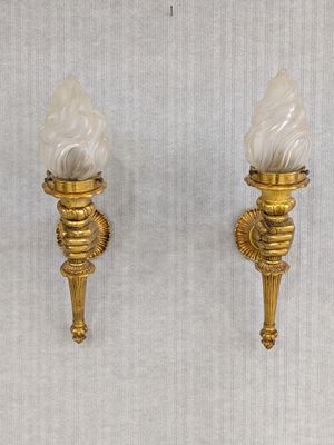 pair of antique brass wall sconces with frosted glass shades
