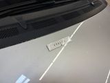 a sticker on the hood of a car with a name on it