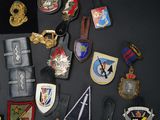 many different types of badges on a black surface