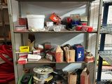 a shelf with many items on it in a room