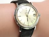 a woman ' s wrist with a watch on it
