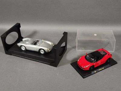 two models of cars on display in a display case