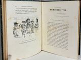 an open book with a picture of a group of people on it
