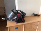 a vacuum that is sitting on top of a dresser