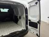 a white van with a mattress in the back of it