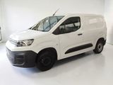 the white van is parked in a white room with a white floor