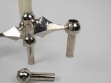 a close up of a faucet with a candle in it