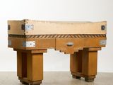 a wooden bench made out of a piece of wood
