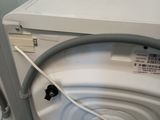 a washer and dryer sitting next to each other in a room
