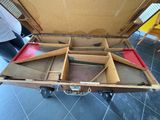 an open suitcase that is sitting on the floor