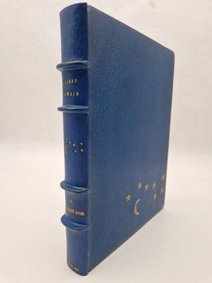 a blue book with gold stars and a crescent on it